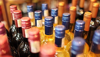 A row of various wine bottles