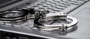 Laptop and Handcuffs